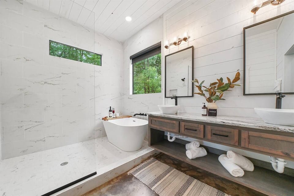 Relax in the freestanding tub with a spacious shower in the King Suite 1. The perfect spot to soak away tension and drift off into ultimate tranquility!