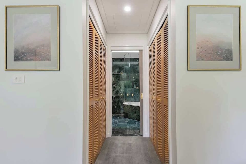 The primary bedroom offers a walk-in closet with two wardrobes offering ample storage for your clothing, luggage and other belongings.