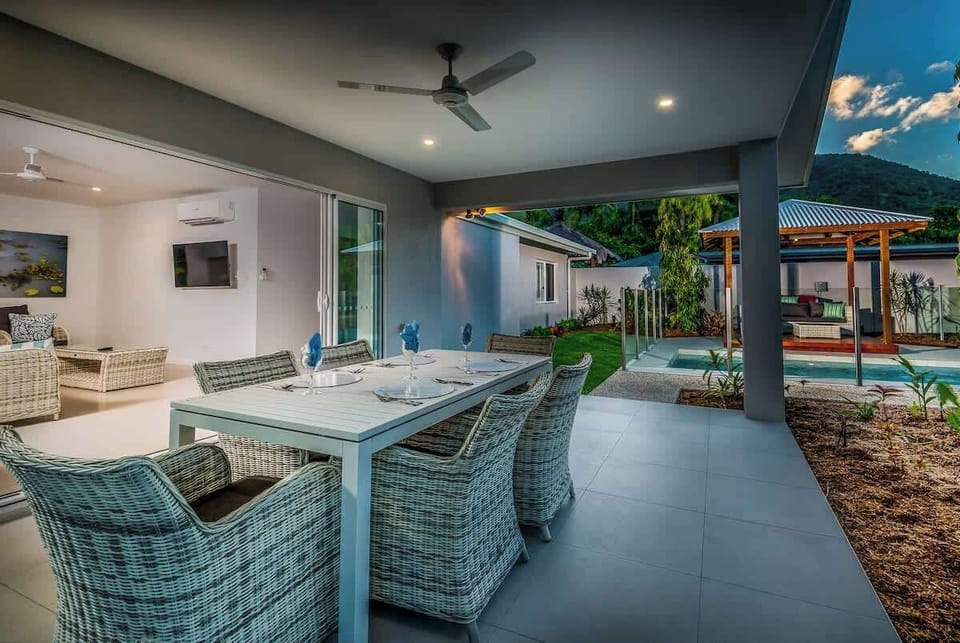 As the day sets,  relax and enjoy dinner out on the                                                                           patio overlooking the grassy yard and pool