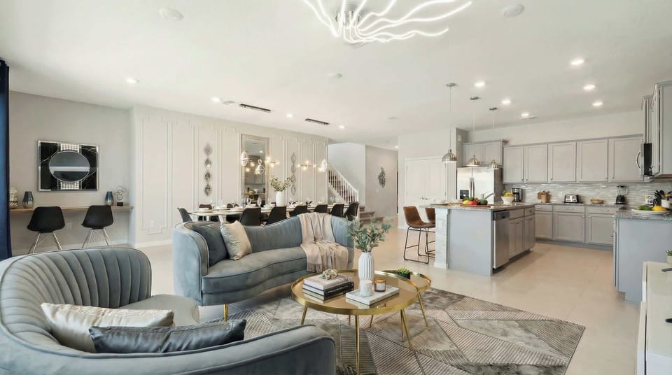 Spacious open-concept living with designer kitchen, luxe lounge, and dining area.