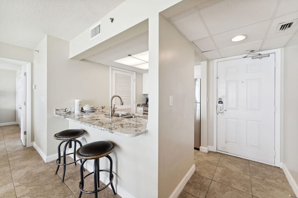 Fully Stocked kitchen with Bar Seating