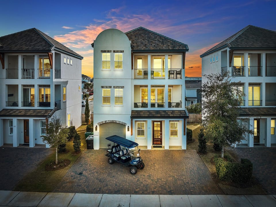 6-seat Golf Cart FREE during your stay! 2 minutes to the beach. Sleeps 17, 6 bedrooms, 5.5 bath, and 13 beds. Game room and bunk rooms. Heated pool across from the house!