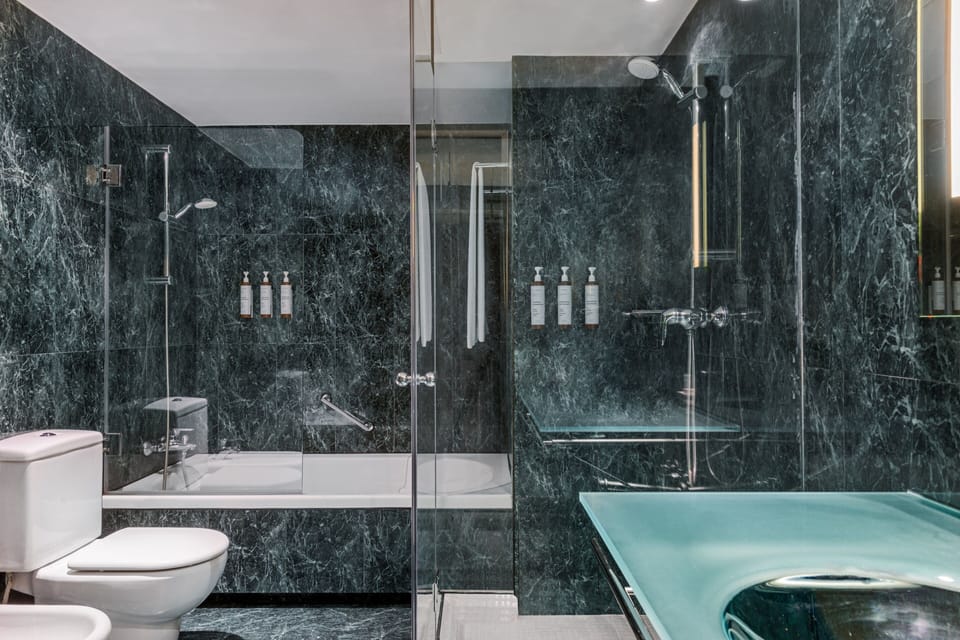 Superior Room, 1 King Bed | Bathroom | Shower, designer toiletries, hair dryer, bathrobes