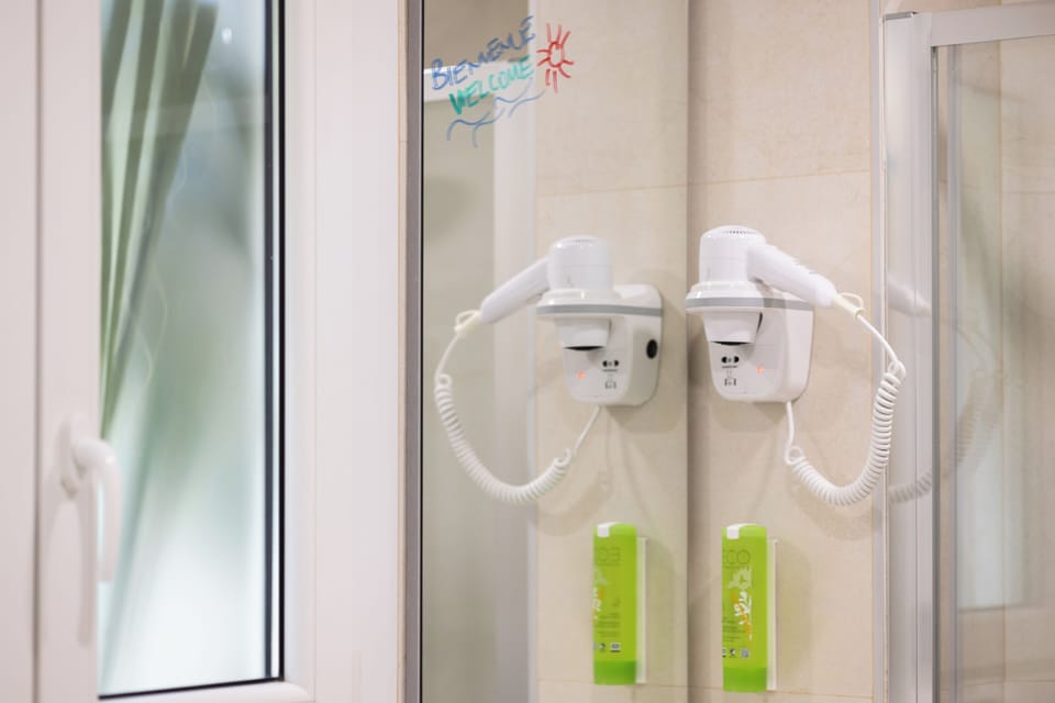 Hair dryer, towels, soap, shampoo