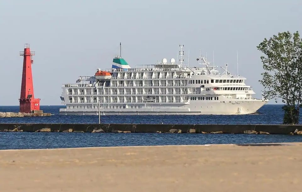 Watch the cruise ships come into Muskegon Lake