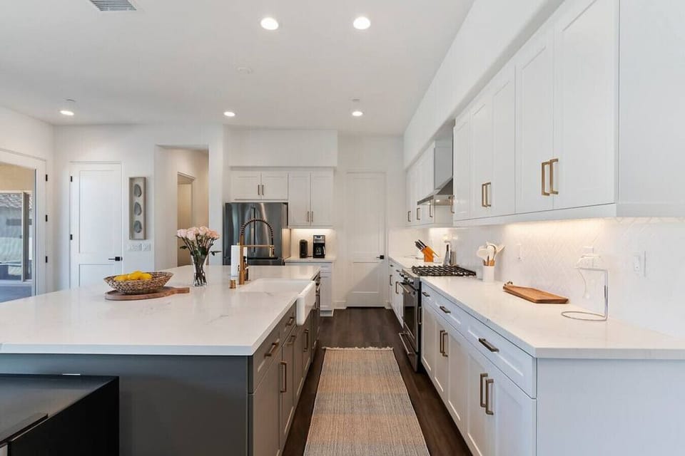 Modern kitchen island w/ seating & clean finishes, perfect for casual meals or gathering