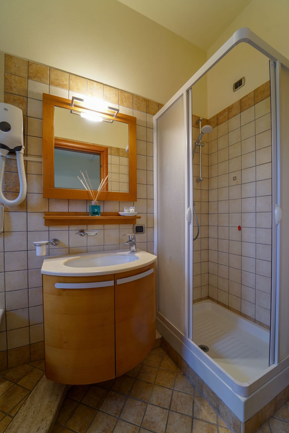 Shower, rainfall showerhead, designer toiletries, hair dryer