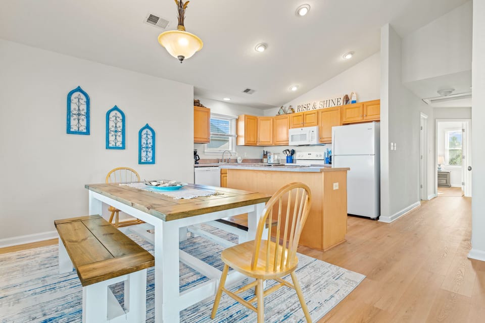Open floorplan offers plenty of room to spread out; hall leads to bedrooms
