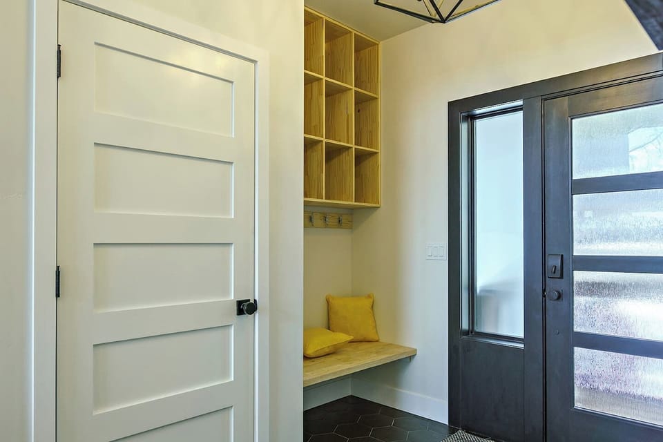 12. coat closet, built-in bench seating, and a set of storage for things