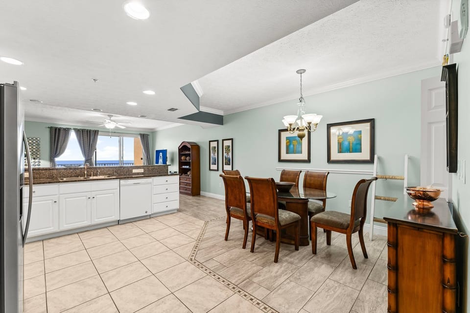 Airy dining area w/ tile floors & plenty of natural light for shared meals.