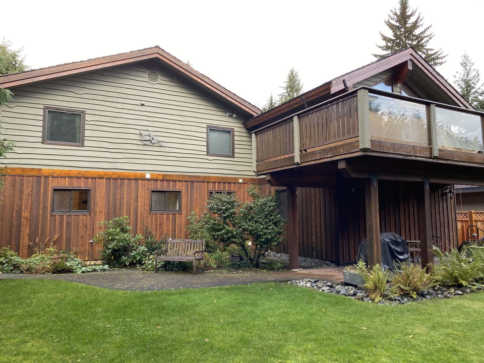 protected patio and landscaped flat lawn