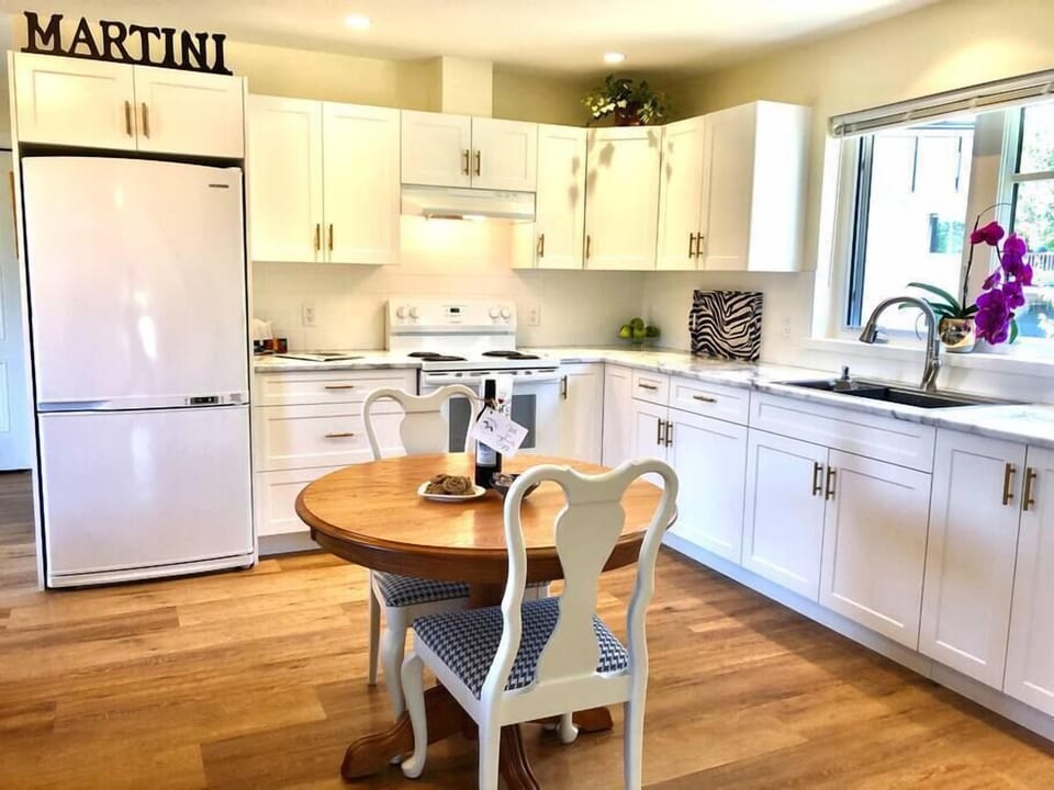 Kitchen has large fridge and freezer
