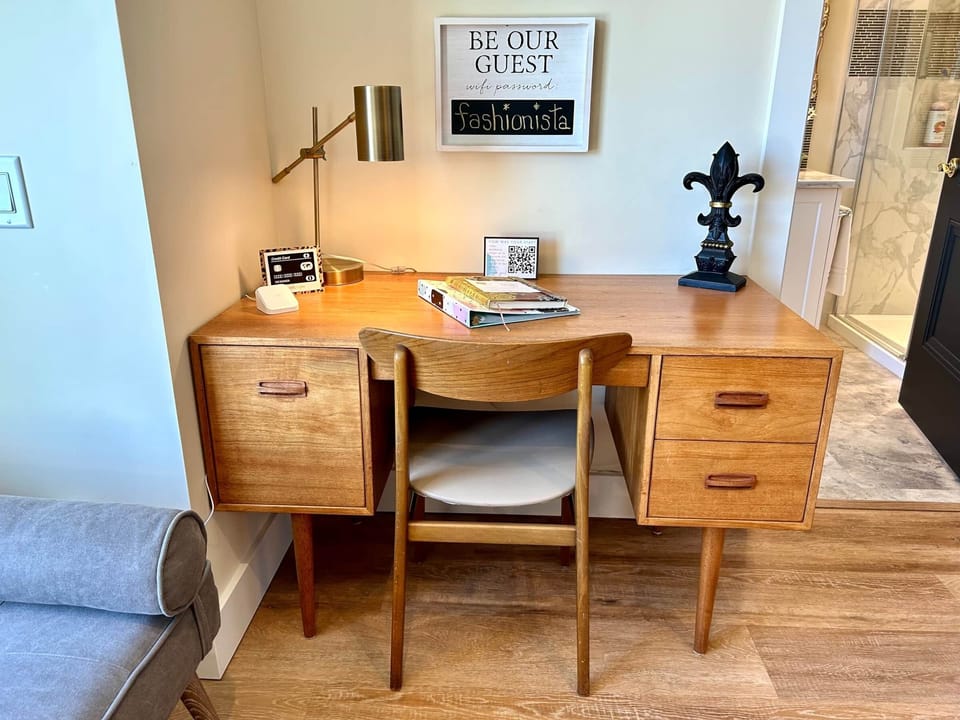 Large work desk with charging station and work lamp. 