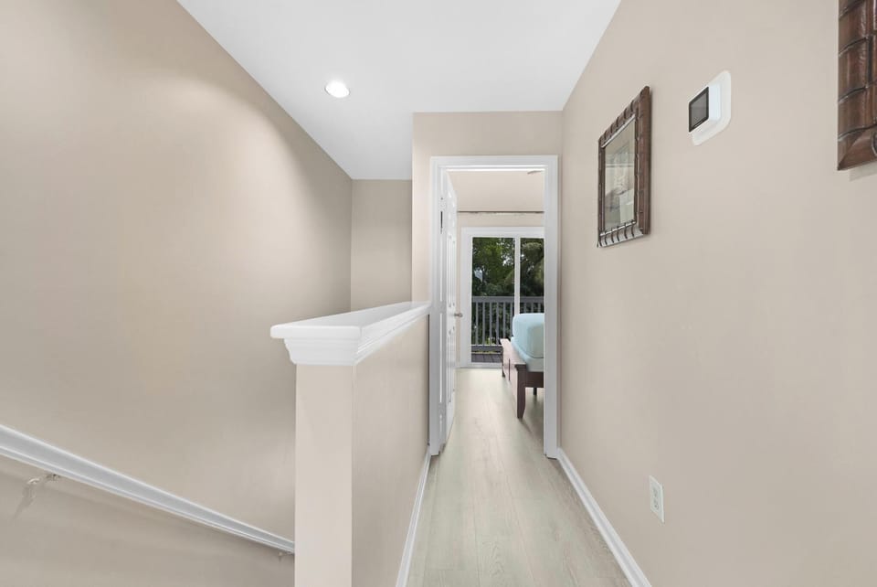 Stairway and hallway that connects master bedroom and guest bedroom