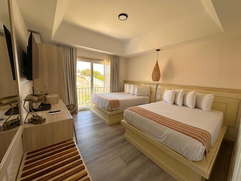 Deluxe Quadruple Room, 2 Double Beds | In-room safe, laptop workspace, blackout drapes, iron/ironing board