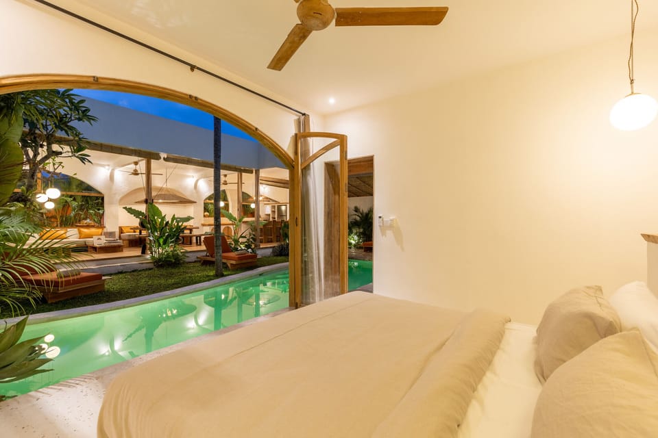 bedroom with pool view