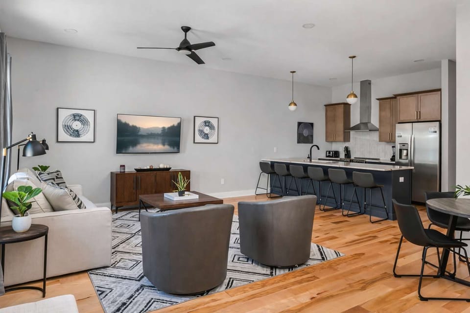 Airy, connected kitchen and living space perfect for gatherings.
