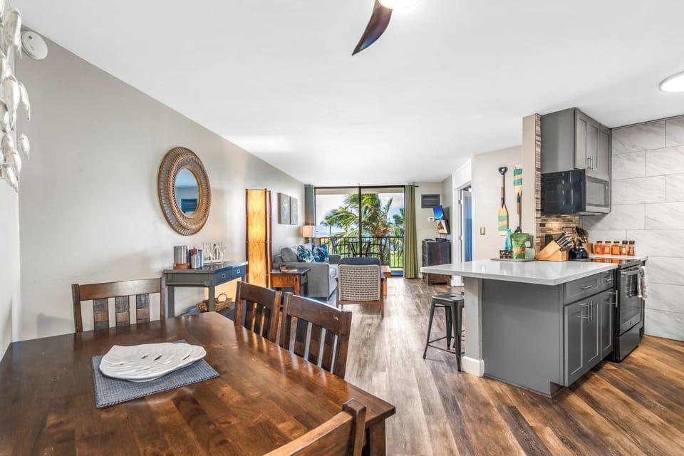 Deluxe Condo | Living area | 55-inch Smart TV with cable channels, TV, Netflix