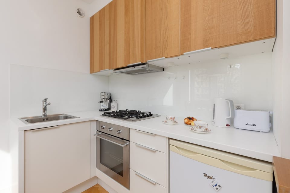 Another view of the kitchen with modern appliances and ample counter space for cooking.
