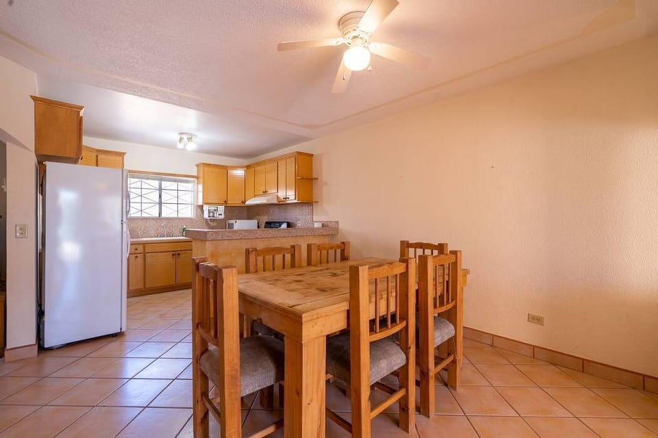 Gather around the dining table at Casa Seascape in Villas de Las Palmas — perfect for family dinners and game nights.