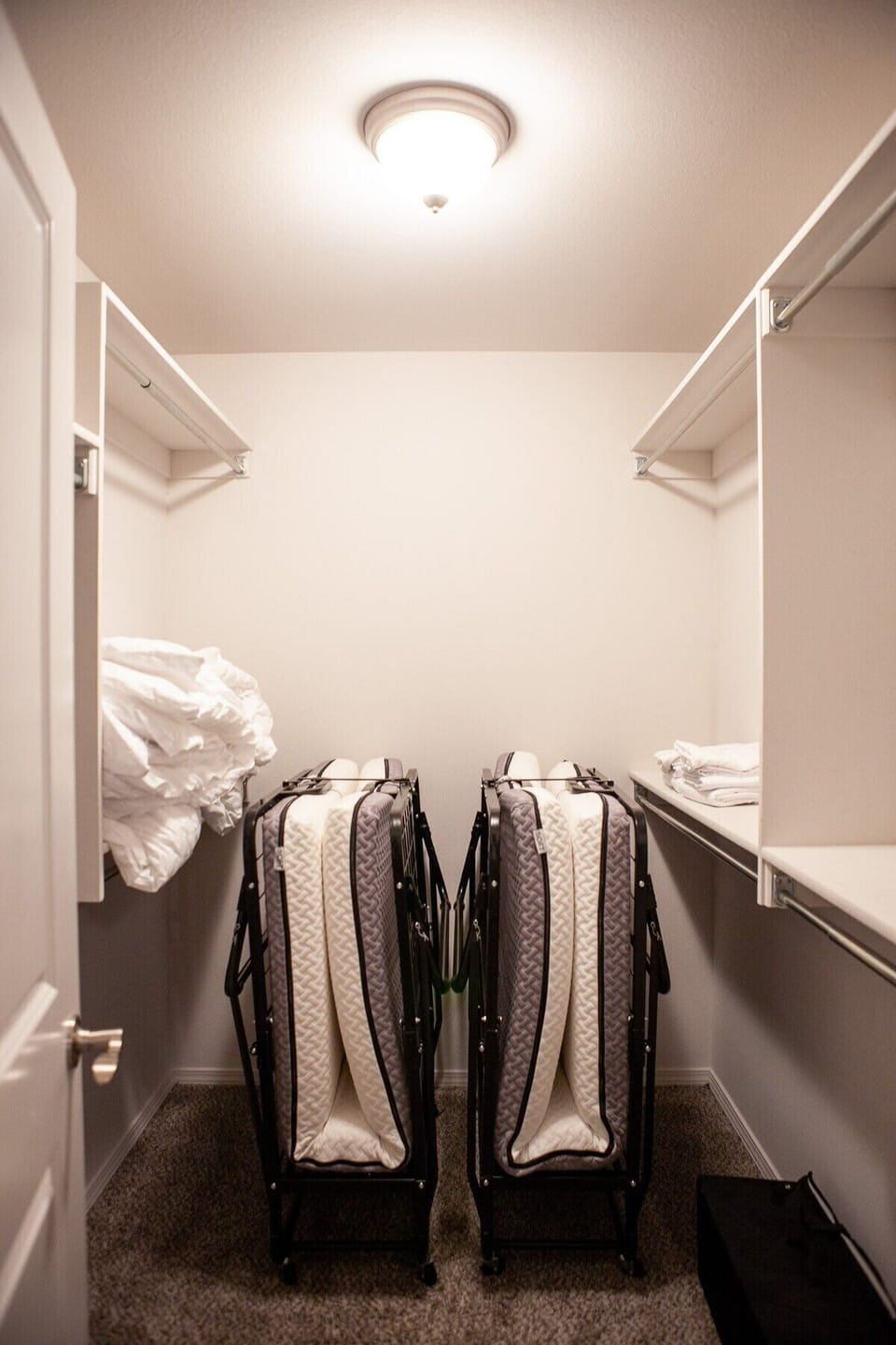 Master Closet: Two twin size roll aways beds. Long enough for adults!
