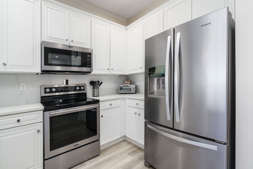 Bright Kitchen with Stainless Steel  Appliances