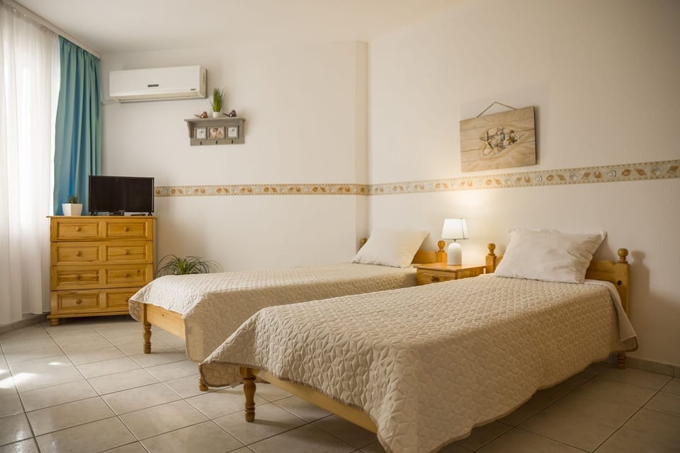 two separate beds,air condition,TV,balcony with a view of the sea