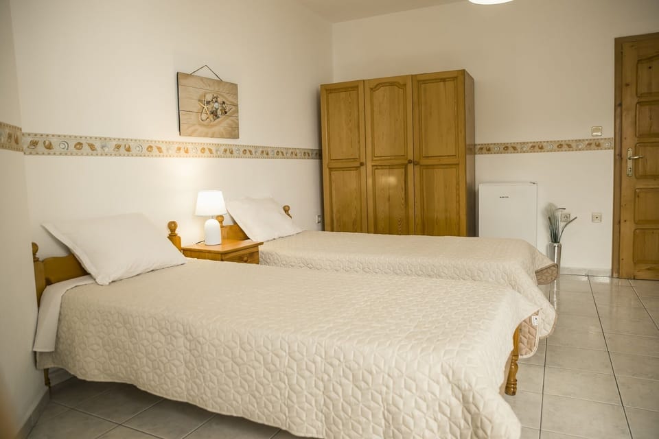 two separate beds,wardrobe, bedside tables, night lamps