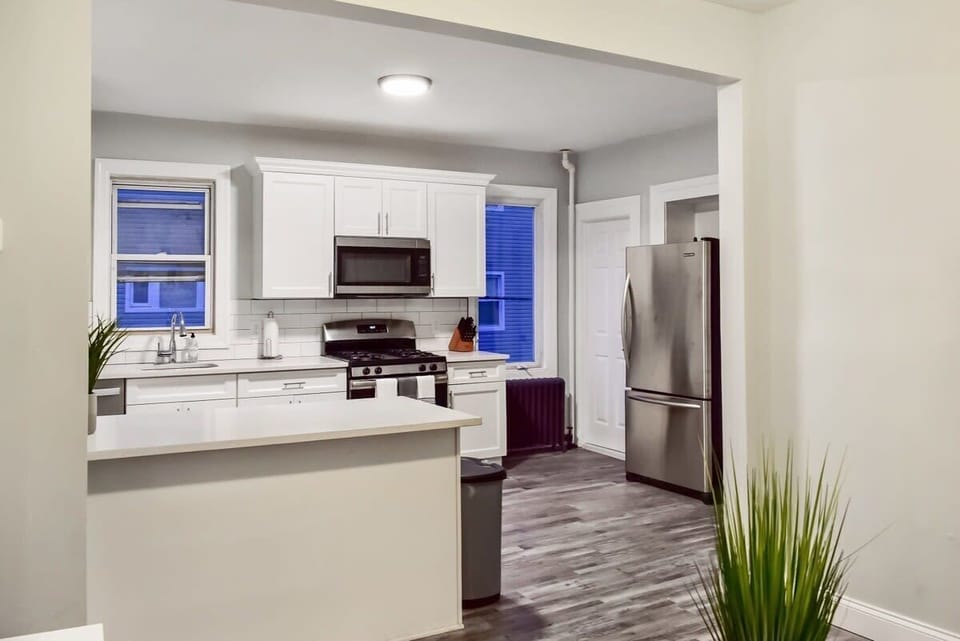 Our huge, chef's kitchen with brand new appliances, cabinets, dishes, pots, pans, and more