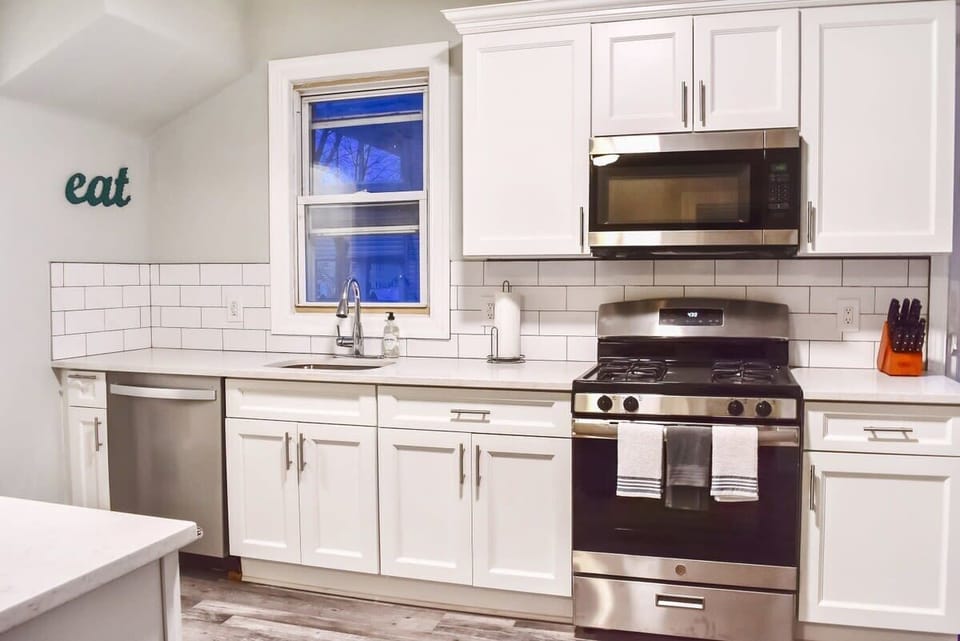 Our huge, chef's kitchen with brand new appliances, cabinets, dishes, pots, pans, and more