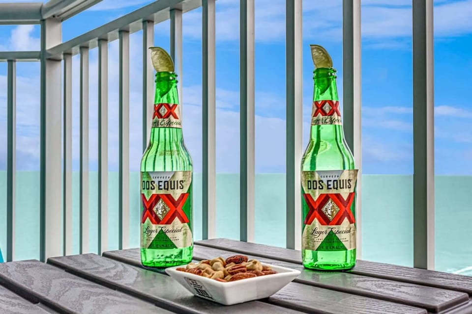 Relax on the balcony with a drink and light snacks while taking in calming ocean views just beyond the railing.