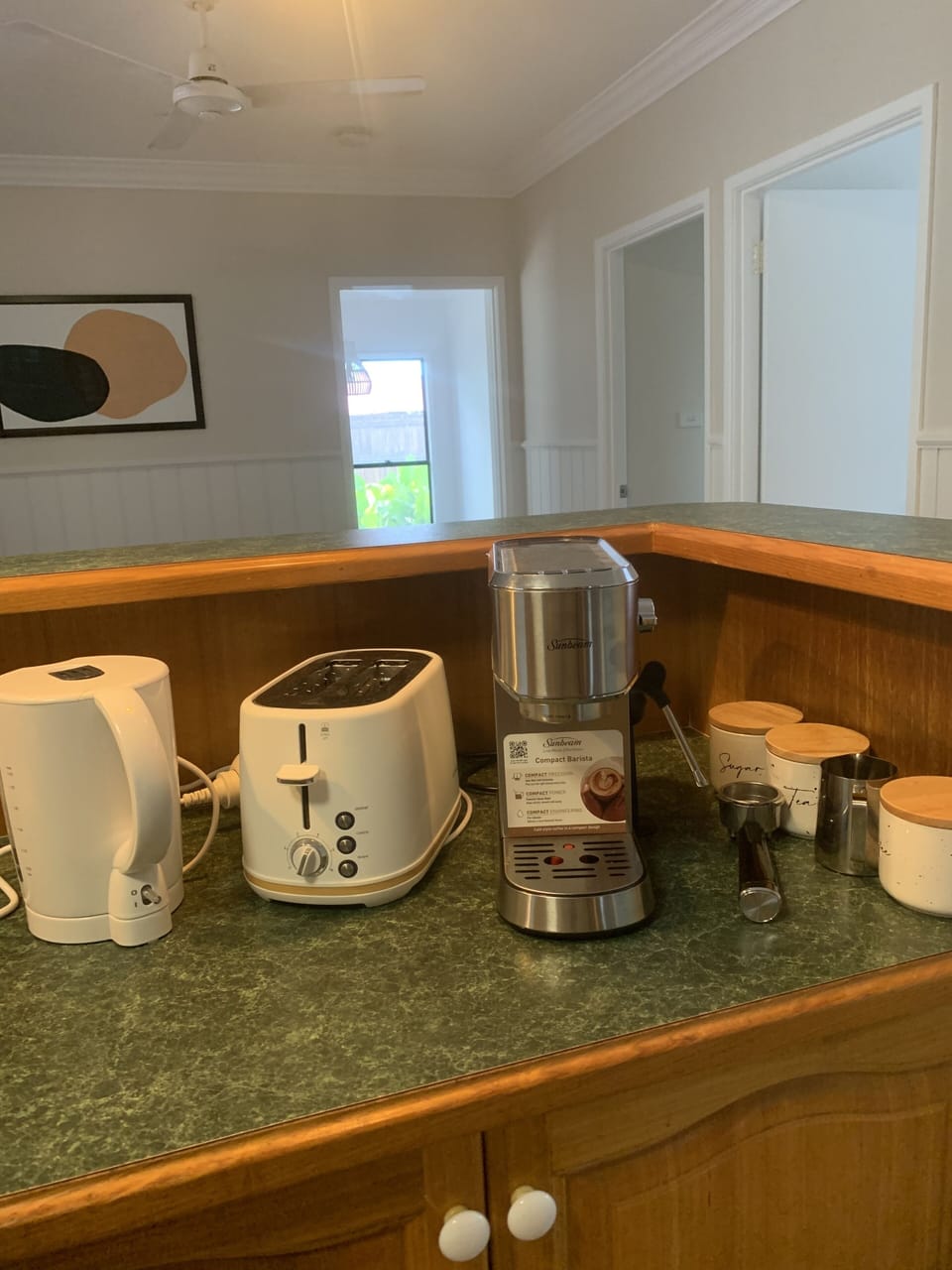 Coffee machine, toaster, kettle, tea, coffee and sugar