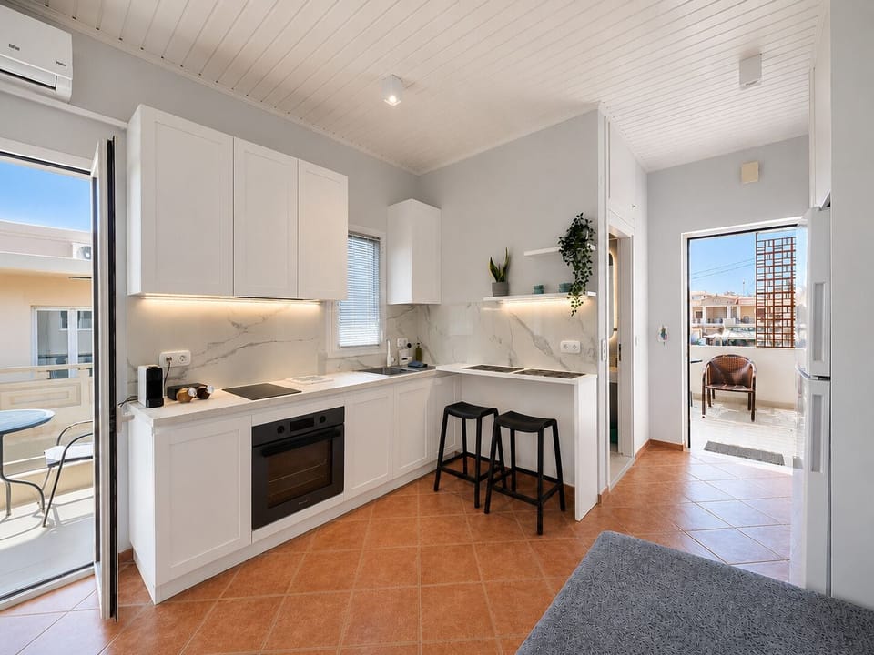 Deluxe Studio, Partial Sea View | Private kitchen | Full-size fridge, oven, stovetop, espresso maker