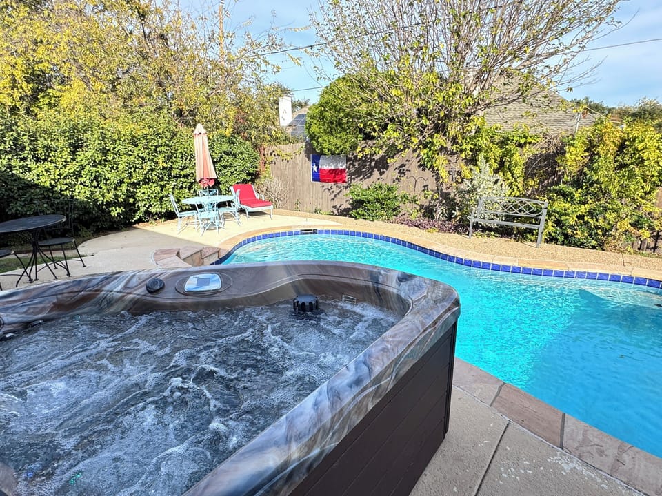 Private pool and hot tub, in a quiet backyard with 8ft tall fence, year long.