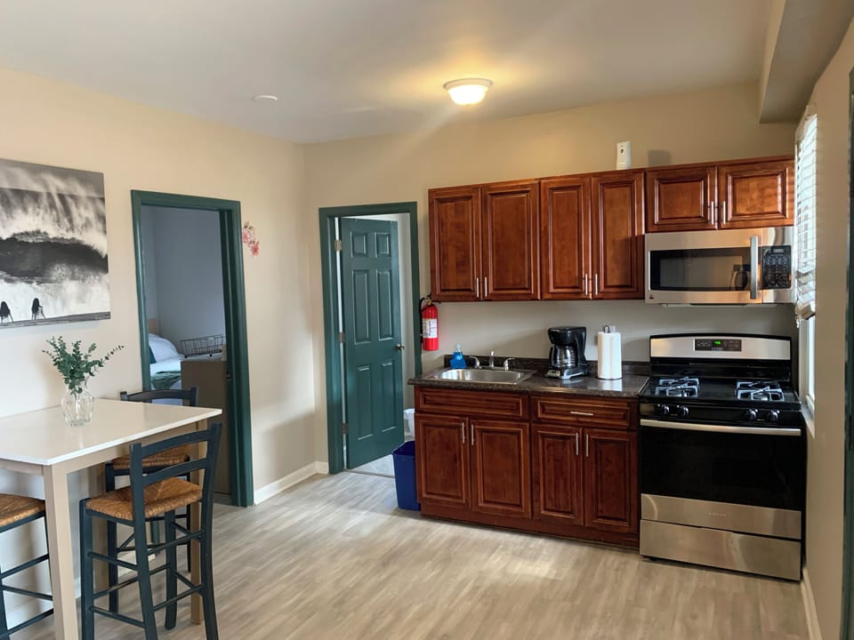 Bright kitchen with stainless appliances and cozy breakfast seating