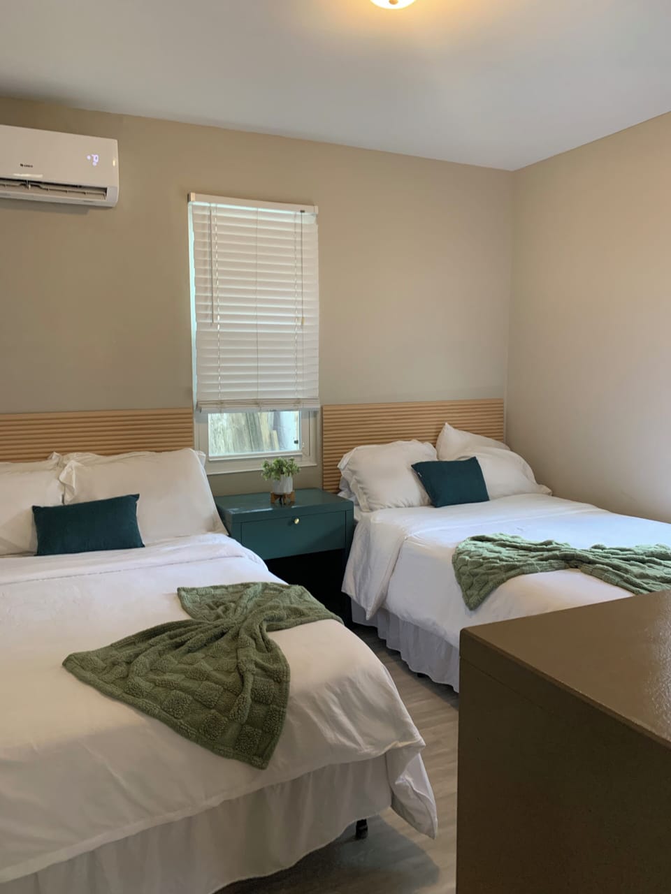 Bright double-bedroom with two cozy beds and A/C for added comfort