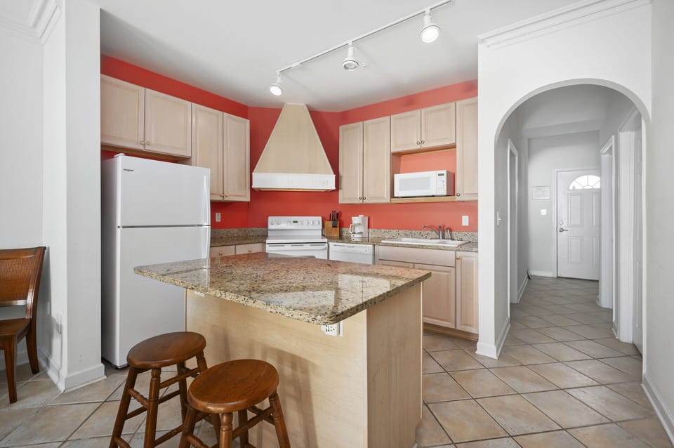 There is no lack of counter space here, there is even seating at the island