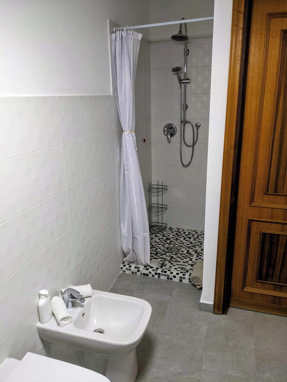 All bathrooms contain a toilet, bidet, sink, heated towel bar, and shower.