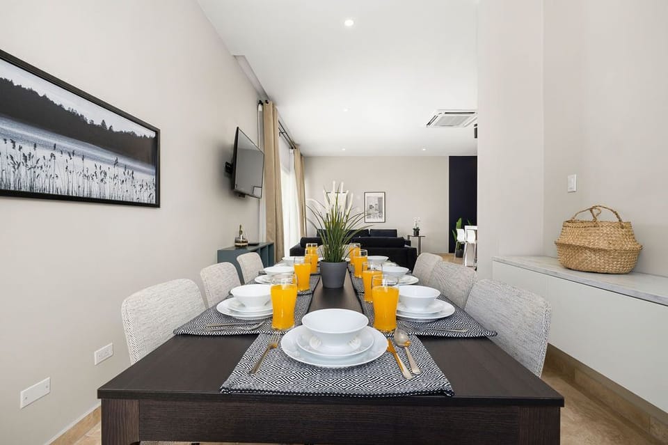 Picture yourself gathered around this elegant dining table, savoring meals with family as natural light fills the open living space. Modern comfort meets thoughtful design in your perfect home away from home.