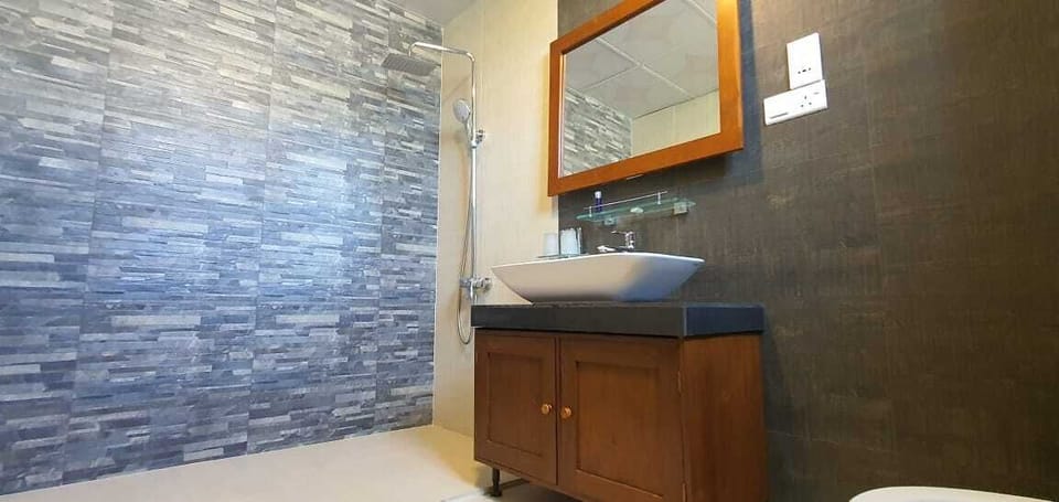 Superior Triple Room | Minibar, in-room safe, desk, laptop workspace