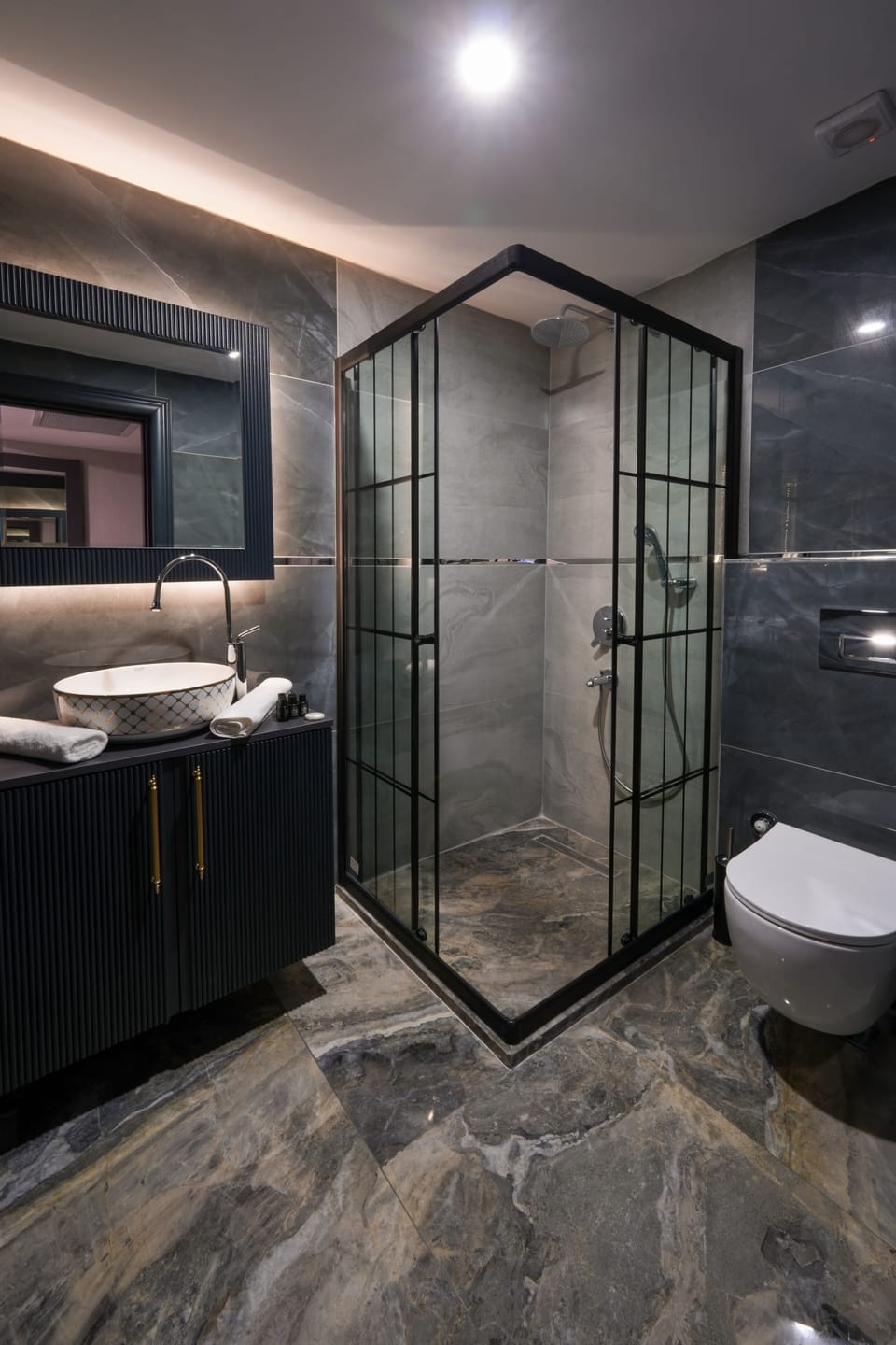 Designer toiletries, hair dryer, bathrobes, slippers