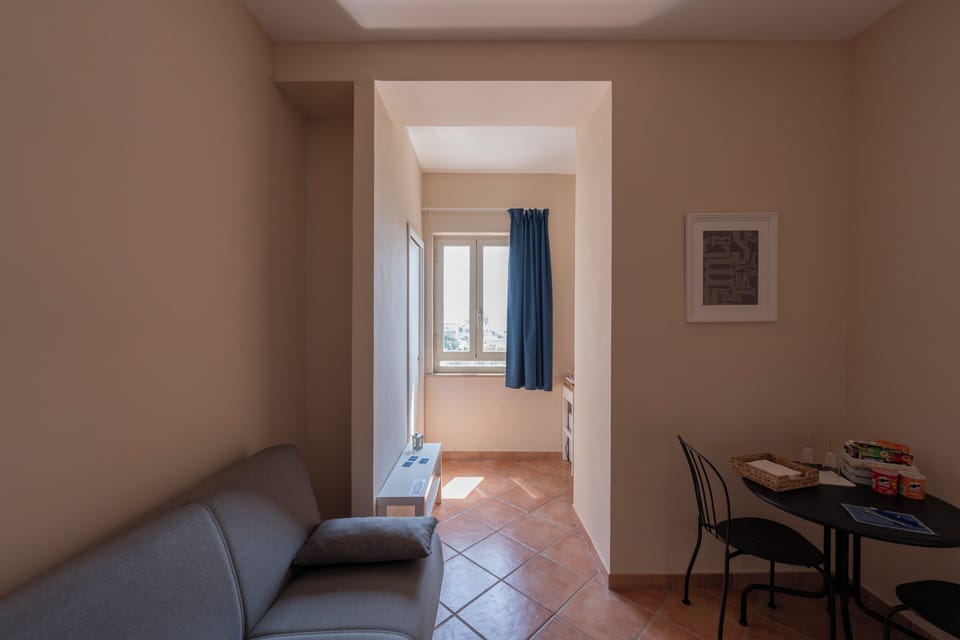 Deluxe Suite | Living area | Flat-screen TV