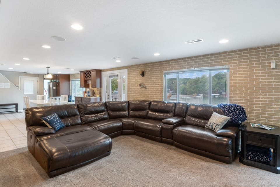 The lake level living area offers comfortable seating, loungers and recliners.
