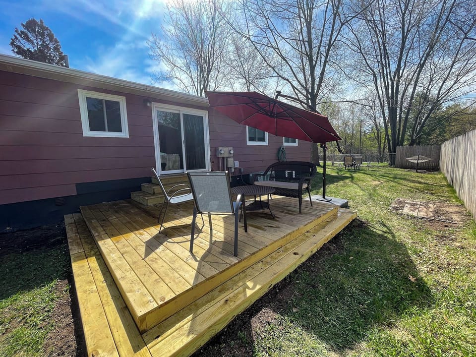 A daytime view of the deck and the other end of the yard