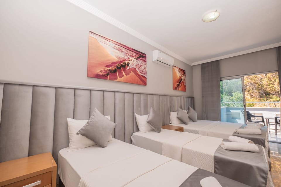 Deluxe Quadruple Room | Premium bedding, in-room safe, soundproofing, iron/ironing board