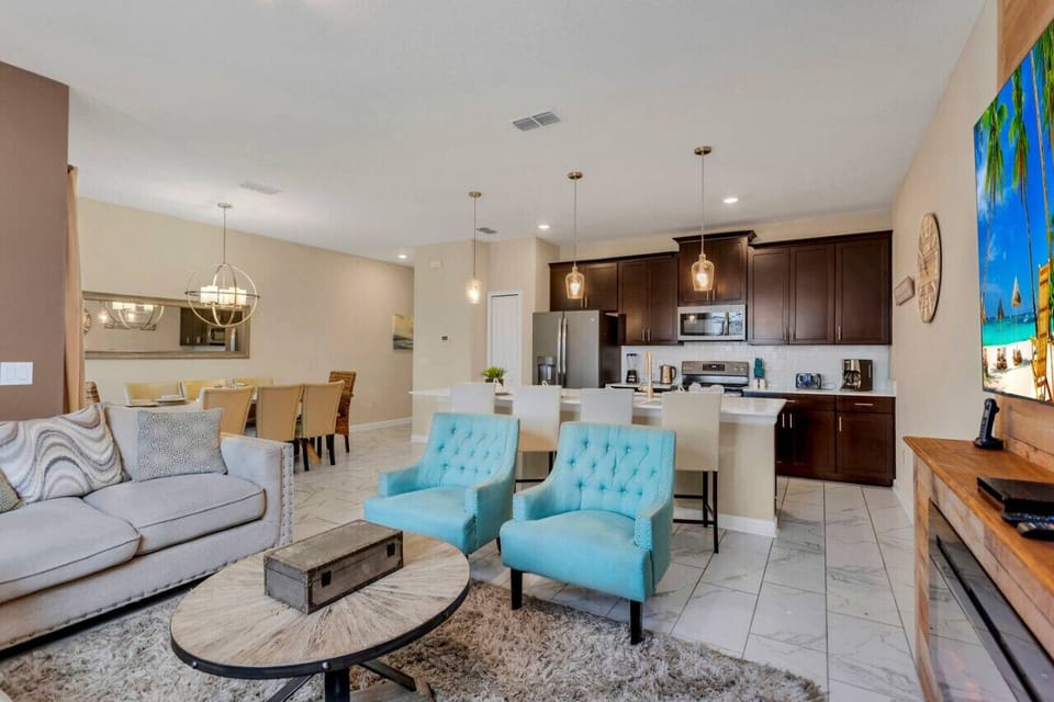 Living Room with open concept blending with Dining Room and Kitchen!#Disney #Parks #kingdom #springs #StoreyLake #Apartment #Vacation #Rental #waterpark #Kissimmee #Orlando #universal #citywalk