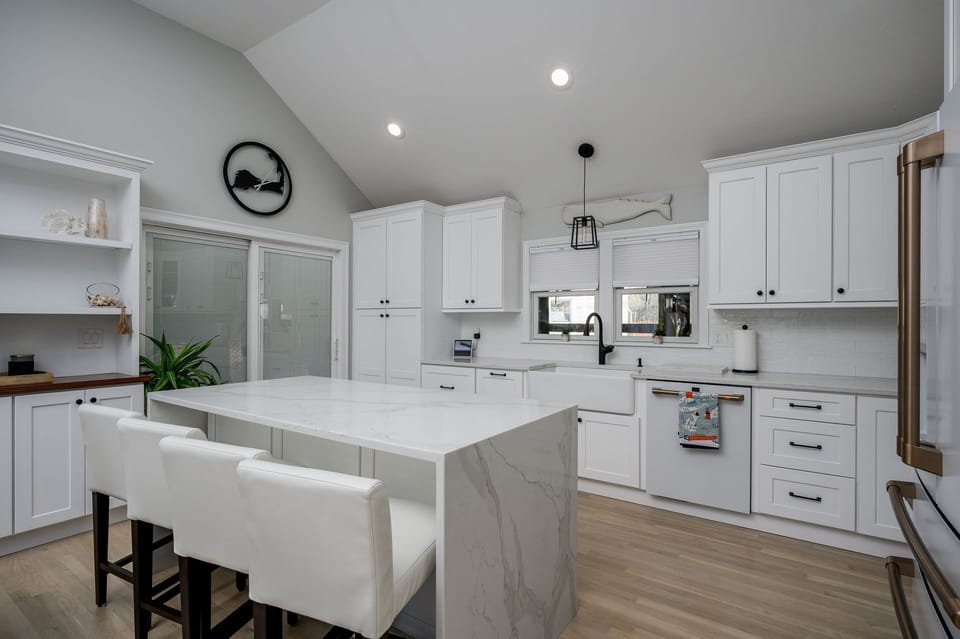 Gorgeously appointed kitchen with sliding glass door to outdoor spaces - 176 Sudbury Lane Hyannis Cape Cod - Family Tides - NEVR