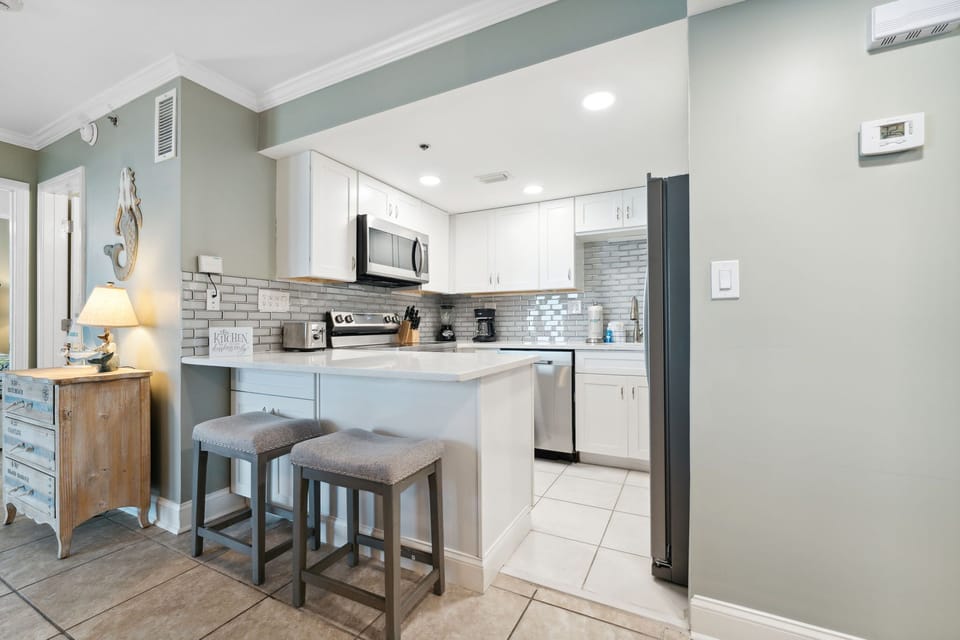 Fully Stocked Kitchen with Bar Seating