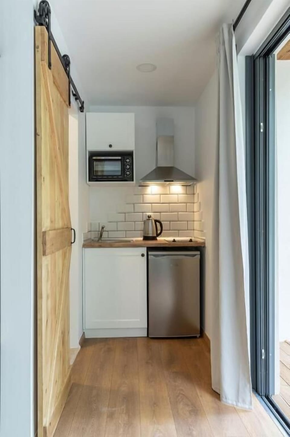 Junior Cabin, Garden Area | Private kitchen | Mini-fridge, microwave, toaster oven, cookware/dishes/utensils