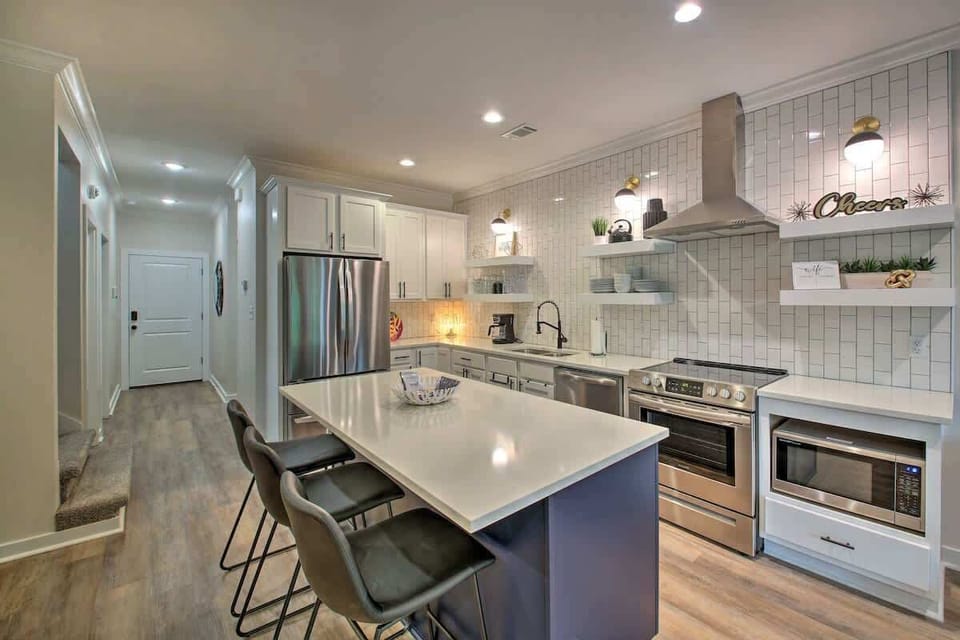 Cook up your favorite meals in a fully stocked, modern kitchen with sleek finishes